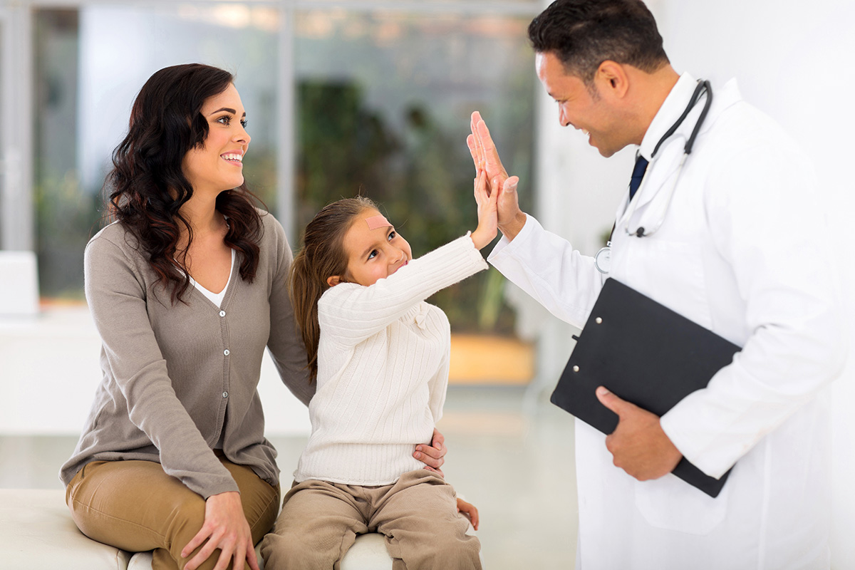 Happy,Little,Girl,And,Paediatrician,Doing,High,Five,After,Medical